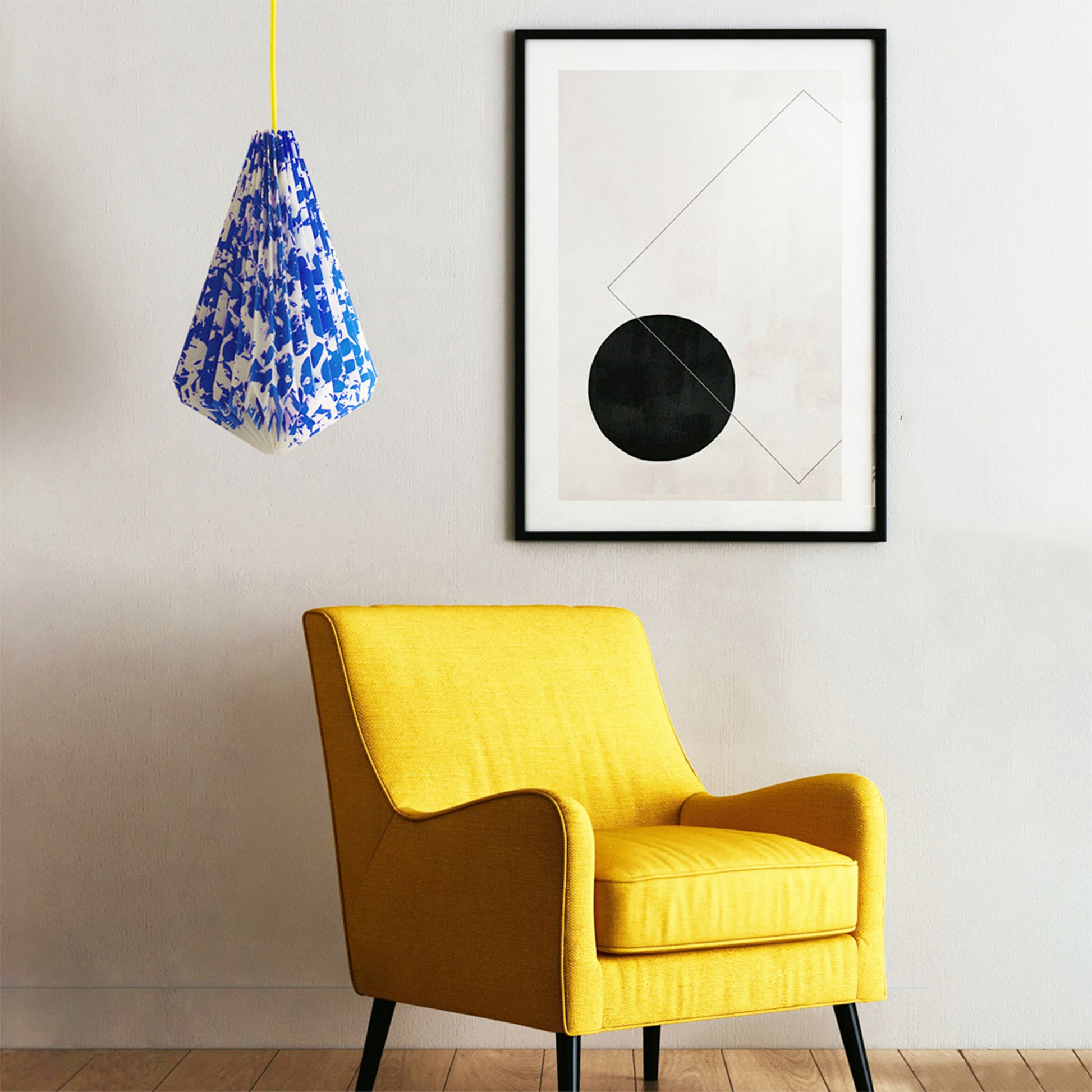 Laboratoire Textile N135 geometric pendant light in blue and white patterned finish, suspended in a contemporary living space.