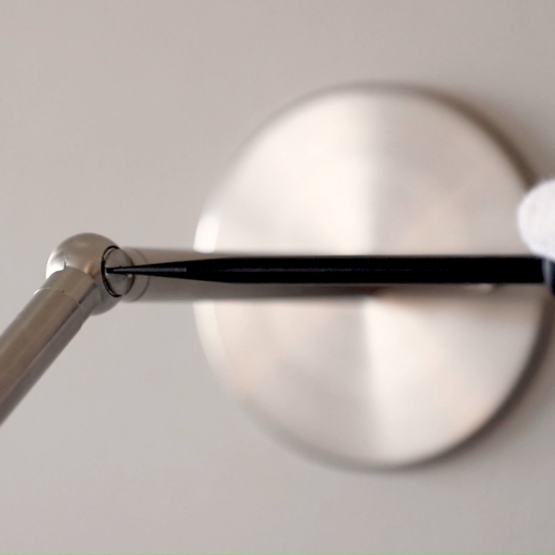 Close-up detail of the adjustable pivot joint and metal hardware on the Marz Designs Terra 0 Long Wall Light.