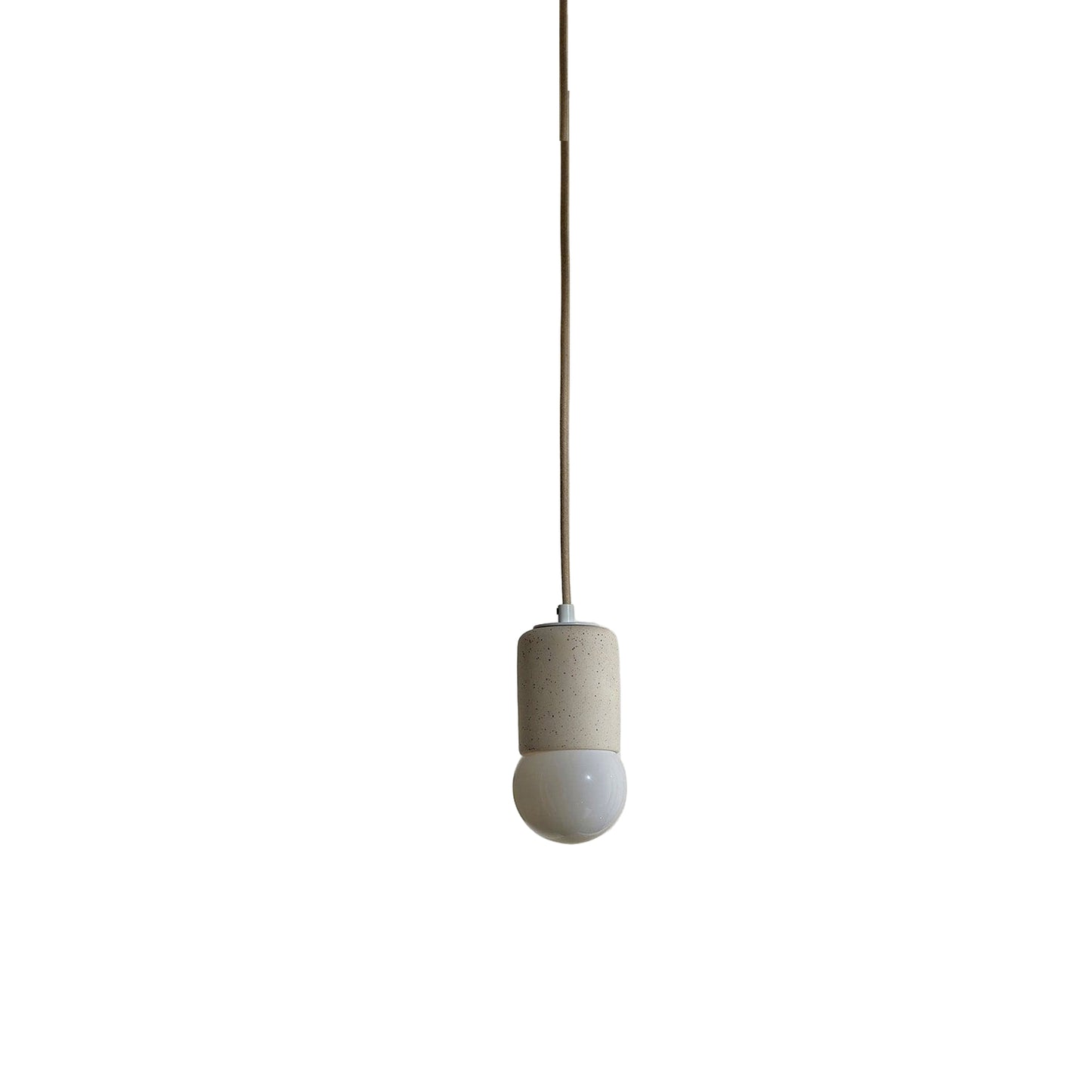 Marz Designs Terra 1 Pendant in Vanilla ceramic and White hardware with fabric flex cord and frosted glass.